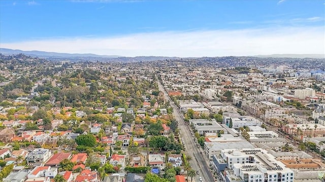 birds eye view of property with a mountain view