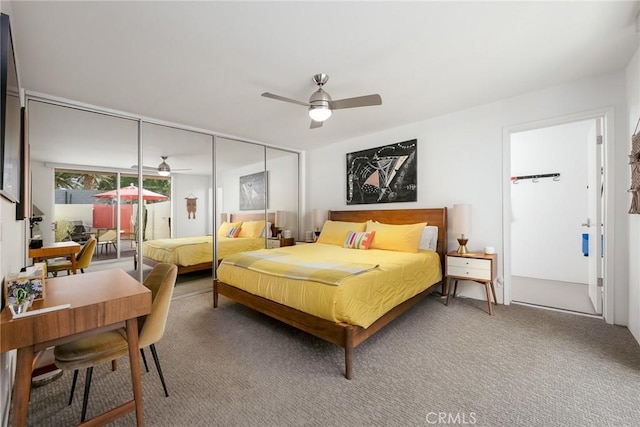 carpeted bedroom with ceiling fan and a closet