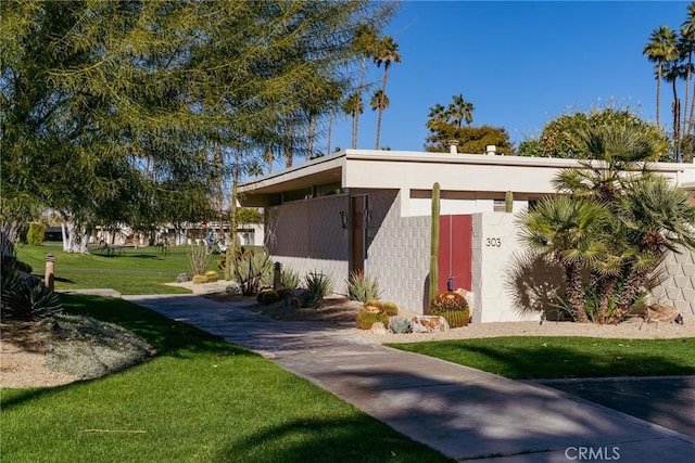 view of outbuilding with a yard