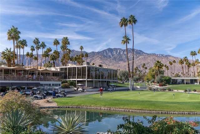 surrounding community featuring a yard and a water and mountain view