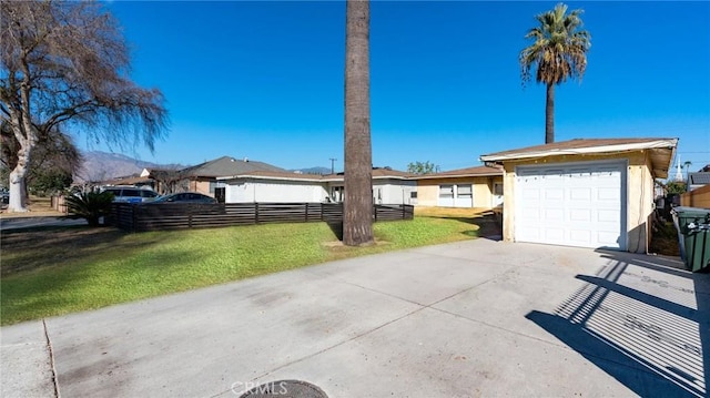 view of front facade with a garage and a front lawn