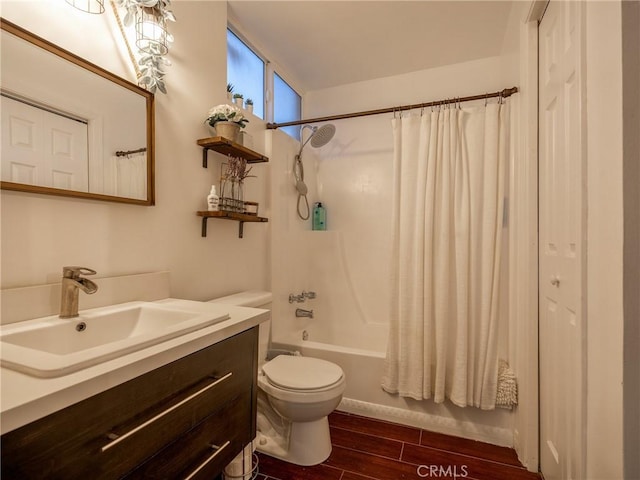 full bathroom with vanity, shower / tub combo, and toilet