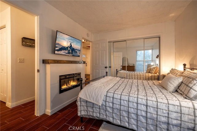 bedroom with a closet and a textured ceiling