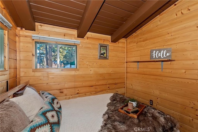 unfurnished bedroom with lofted ceiling with beams and wooden ceiling