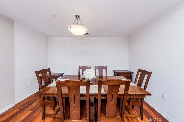 dining room featuring dark wood-type flooring