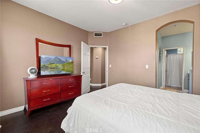 bedroom featuring dark hardwood / wood-style flooring