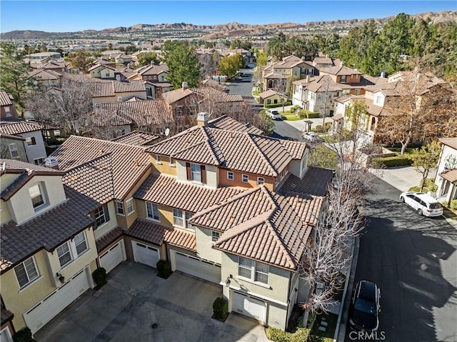 birds eye view of property featuring a mountain view