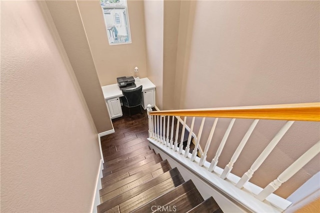 stairway featuring hardwood / wood-style floors