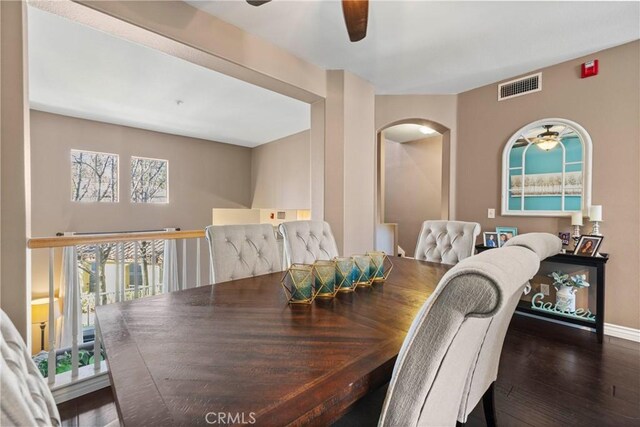 dining space featuring ceiling fan, plenty of natural light, and dark hardwood / wood-style flooring