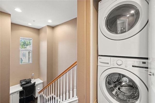 laundry room with stacked washer and clothes dryer