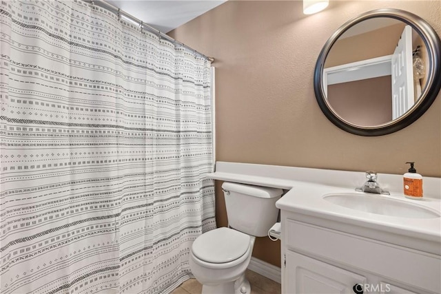 bathroom with tile patterned flooring, vanity, a shower with curtain, and toilet