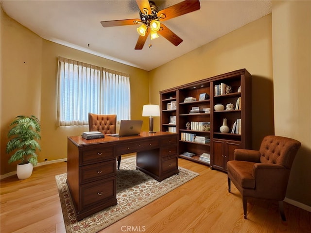 office featuring light hardwood / wood-style flooring and ceiling fan