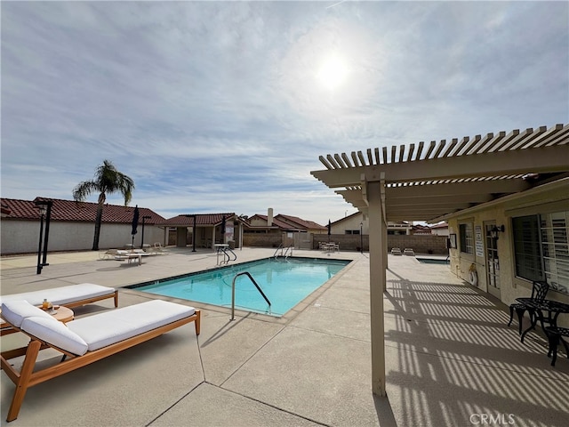 view of swimming pool featuring a pergola and a patio