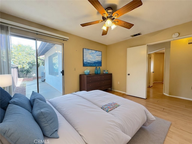 bedroom featuring access to outside, ceiling fan, and light hardwood / wood-style flooring