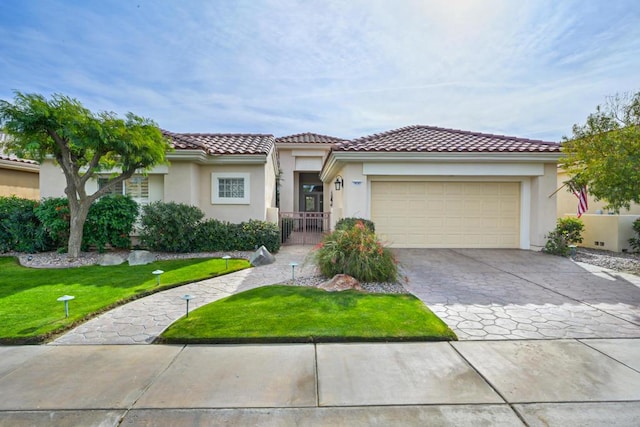 mediterranean / spanish-style home featuring a garage and a front lawn