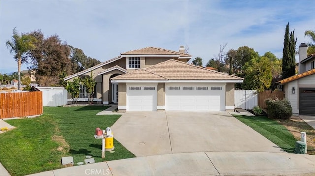 view of front of house with a garage and a front lawn