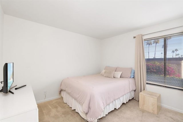 bedroom with light carpet