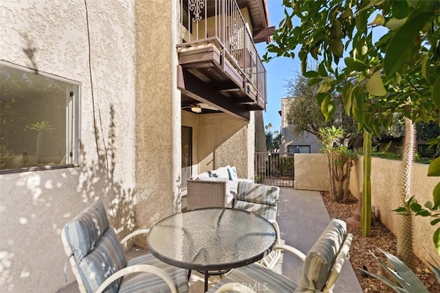 view of patio featuring a balcony