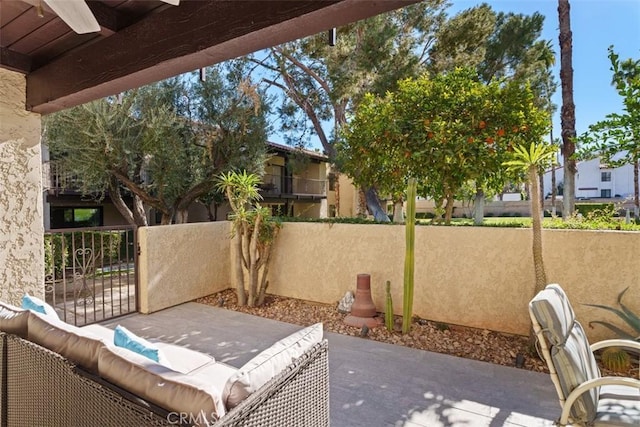 view of patio featuring ceiling fan