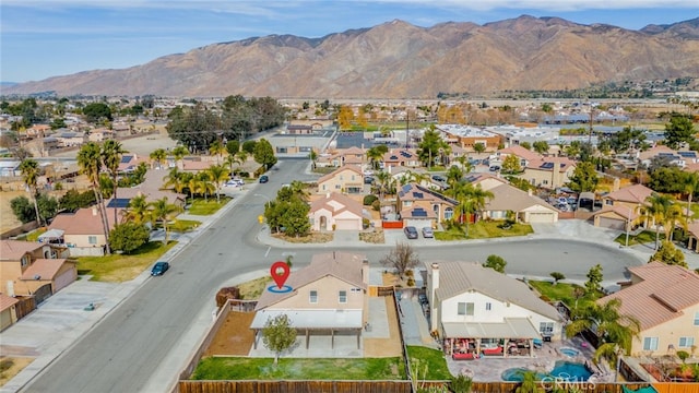 birds eye view of property with a mountain view