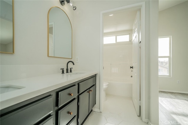 full bathroom with shower / bath combination, vanity, tile patterned floors, and toilet