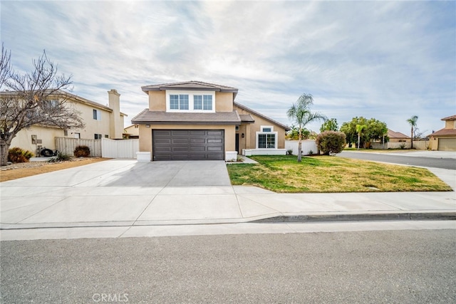 view of property featuring a garage and a front yard