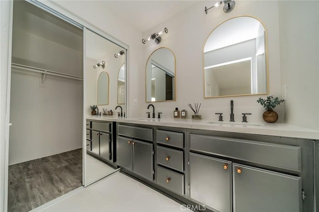 bathroom with vanity and hardwood / wood-style flooring