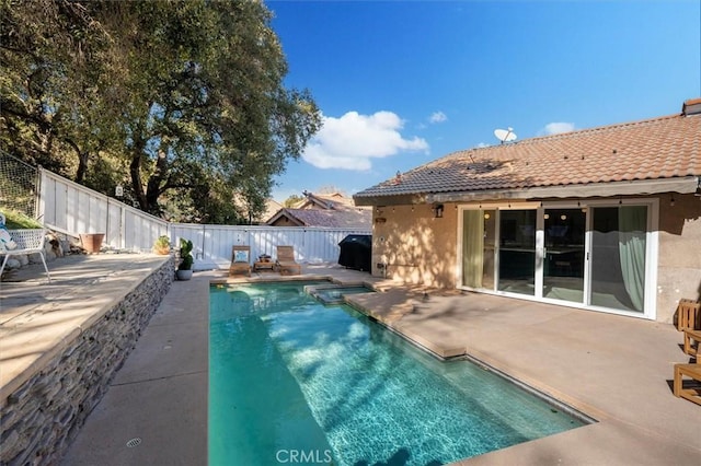 view of pool with a patio area, a fenced backyard, and grilling area