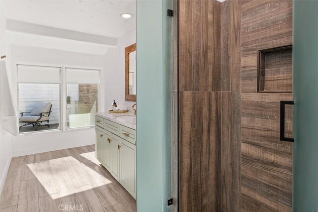 23726 La Salle Canyon Rd, Newhall, CA 91321 - full bathroom featuring vanity, wood finished floors, and a shower