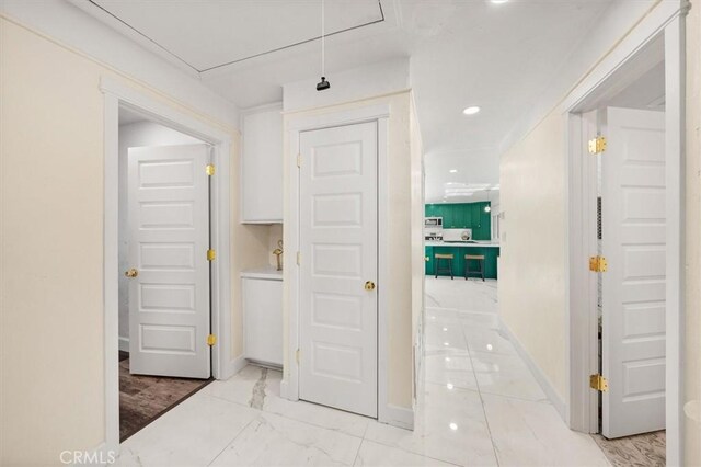 23726 La Salle Canyon Rd, Newhall, CA 91321 - hallway featuring light marble finish flooring, recessed lighting, and attic access