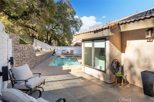 view of swimming pool with a patio, a fenced backyard, and a fenced in pool