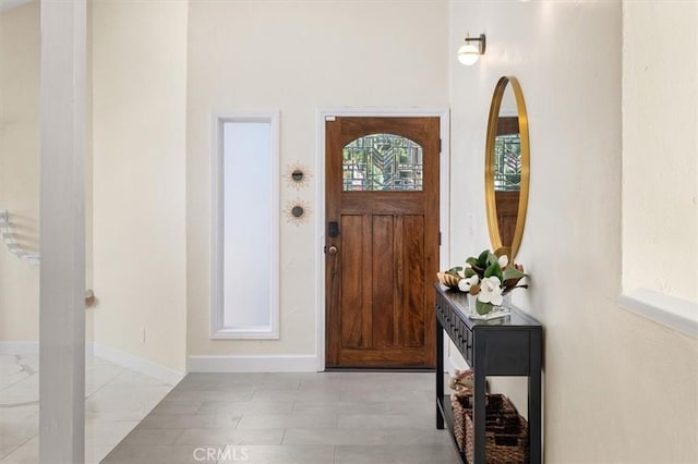 entryway featuring baseboards