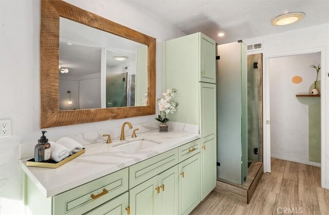 23726 La Salle Canyon Rd, Newhall, CA 91321 - bathroom featuring vanity, wood finished floors, and a shower stall