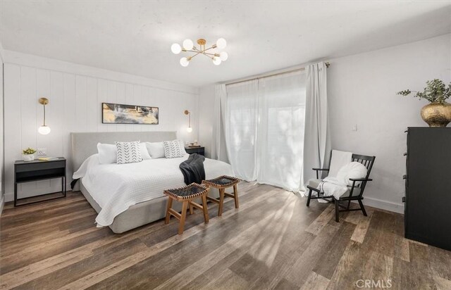 23726 La Salle Canyon Rd, Newhall, CA 91321 - bedroom featuring wood finished floors and a chandelier