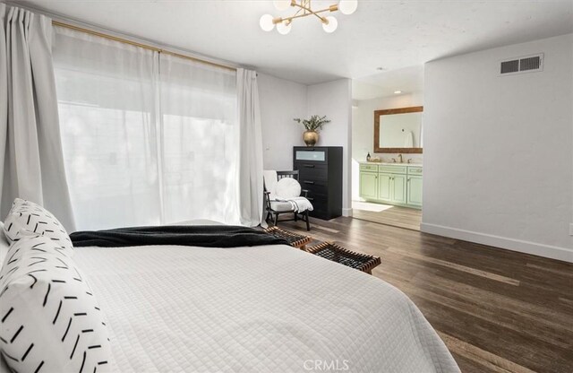 23726 La Salle Canyon Rd, Newhall, CA 91321 - bedroom featuring dark wood-style flooring, a chandelier, and ensuite bathroom