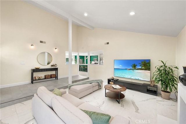 living area with marble finish floor, beam ceiling, visible vents, and baseboards