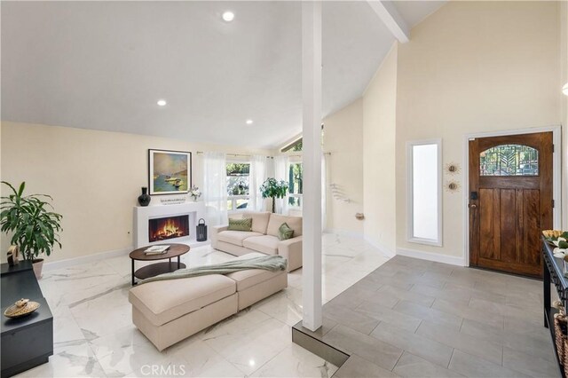 23726 La Salle Canyon Rd, Newhall, CA 91321 - foyer with a warm lit fireplace, recessed lighting, high vaulted ceiling, marble finish floors, and beamed ceiling