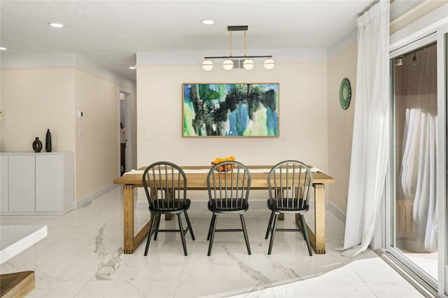 dining space featuring recessed lighting, marble finish floor, and baseboards