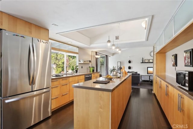 kitchen with a kitchen island, appliances with stainless steel finishes, dark hardwood / wood-style floors, light brown cabinetry, and sink