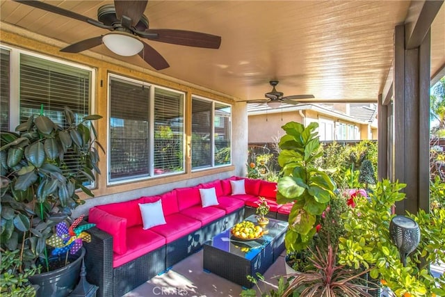 sunroom featuring ceiling fan