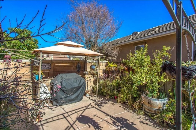 view of patio / terrace with a gazebo and grilling area