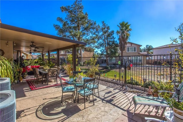 view of patio featuring central AC and ceiling fan