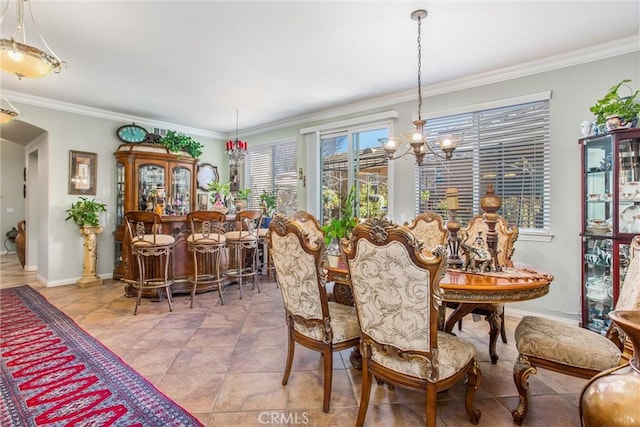 tiled dining space featuring crown molding, indoor bar, and a chandelier