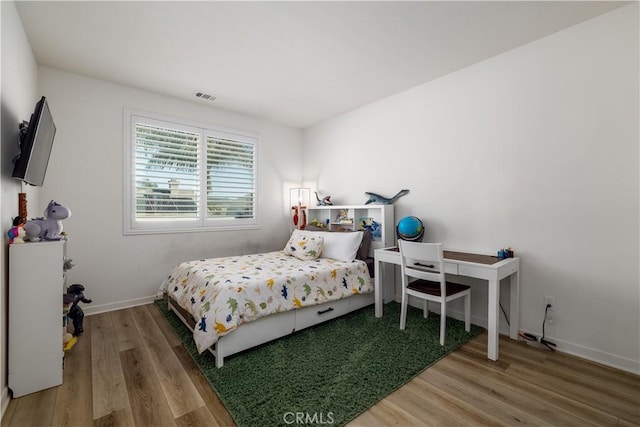 bedroom featuring hardwood / wood-style flooring