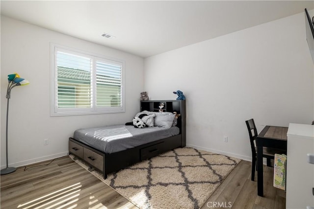 bedroom featuring hardwood / wood-style flooring