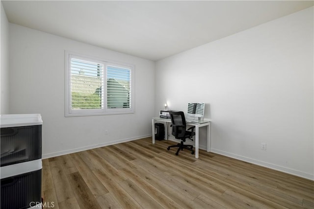 home office featuring hardwood / wood-style flooring