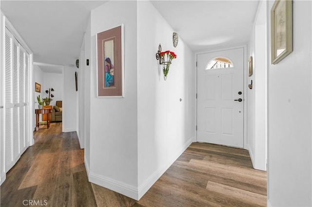 hall with dark wood-type flooring