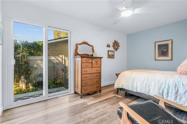 bedroom with ceiling fan, light hardwood / wood-style floors, and access to outside