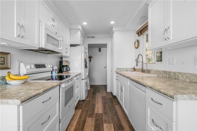 kitchen featuring white cabinetry, sink, white appliances, and dark hardwood / wood-style flooring