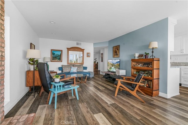 living room featuring dark wood-type flooring